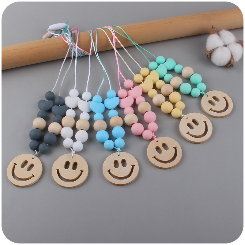 Nuevo bebé suministros smiley cara mordedor collar bebé cuentas de silicona mordida molar masticable colgante collar
