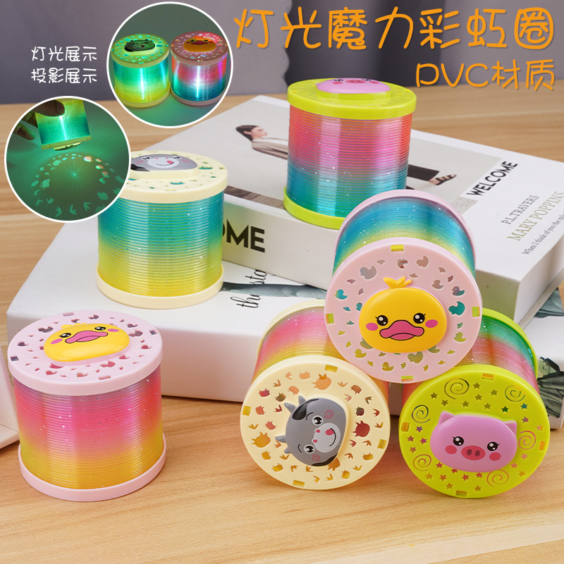 Tiktok misma proyección de dibujos animados Arco Iris anillo puesto juguetes luminosos al por mayor niños primavera anillo flash Jenga