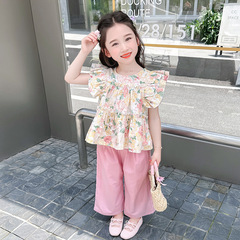 Set of two summer outfits for girls: stylish and trendy floral child's dress with short sleeves and korean-style wide-leg pants