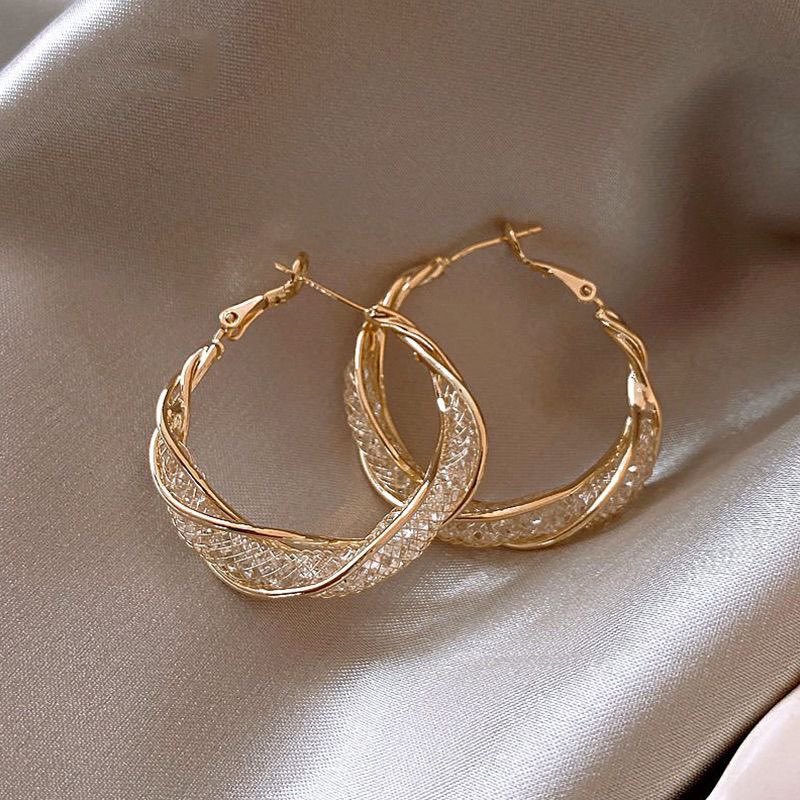 2023 cross-border new winding metal earrings twisted metal hollow irregular earrings high design sense