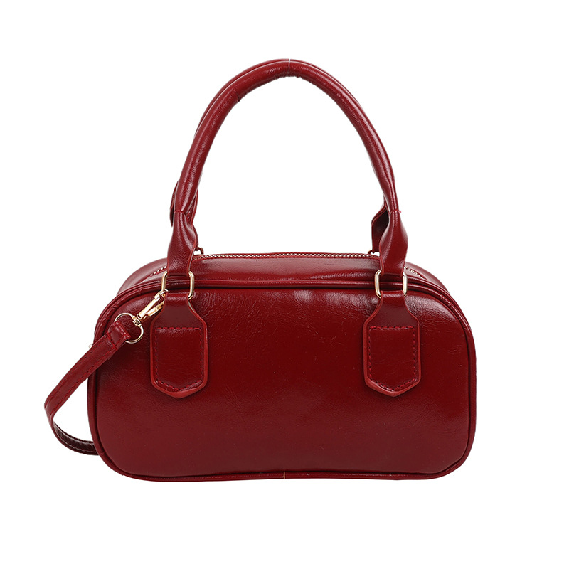 Versión coreana del bolso pequeño de Boston otoño e invierno nuevo bolso portátil para las axilas bolso de bolos literario de moda bolso diagonal de un solo hombro