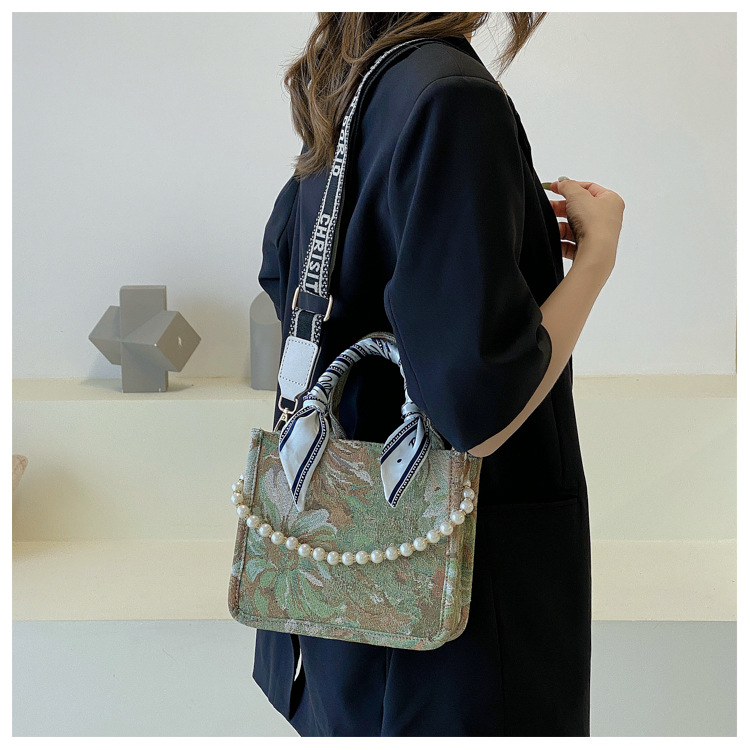 Bolso de mujer 2025, nuevo estilo transfronterizo, bolso tote con estampado de letras, con un toque de alta gama, diseño exclusivo, práctico para salidas y viajes diarios.