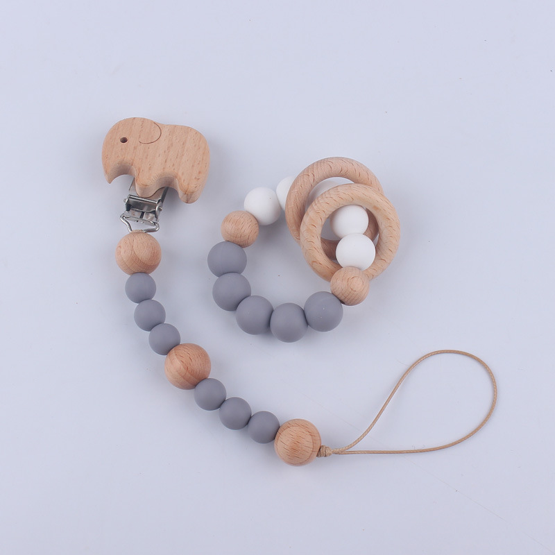 Nuevo Bebé y niño suministros de dibujos animados clip de haya calmante bebé chupete cadena mordedor pulsera de juguete conjunto de dos piezas