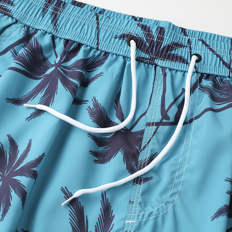 Spot wholesale pareja pantalones de playa hombres sueltos de talla grande casual pantalones cortos de mujer de vacaciones deportes pantalones cortos deportivos elásticos de cuatro caras
