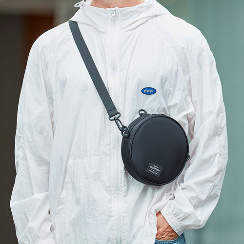 New trendy brand crossbody bag for men—casual, niche-style round single-shoulder bag; chic hand-held small round bag—Japanese-inspired design for women.
