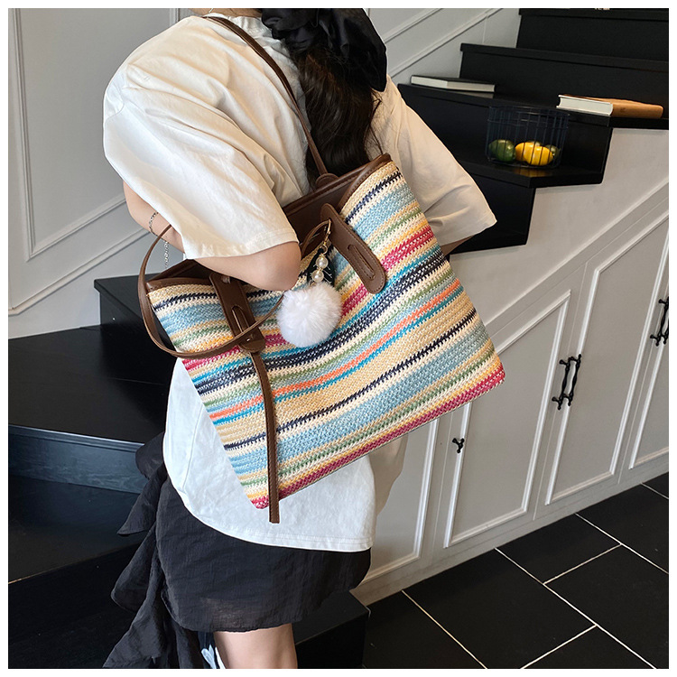 This is a new 2025 summer beach-style women's bag with a simple and versatile hand-held design. It's a single-shoulder vacation woven bag undefined