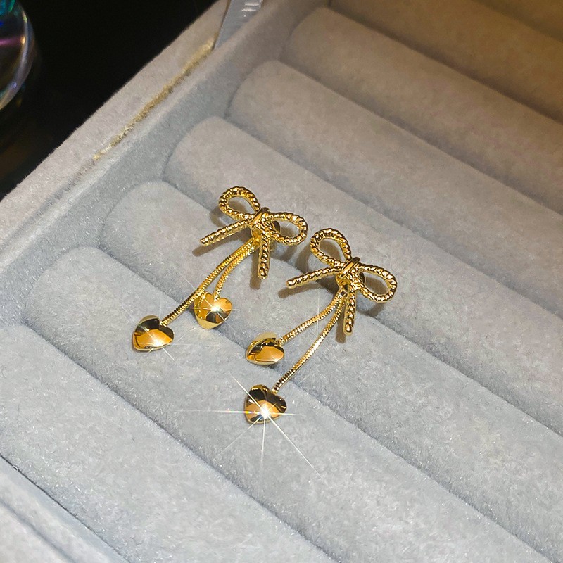 Aguja de plata Pendientes de lazo de diamantes coreanos Pendientes de temperamento de moda de todo fósforo Pendientes de diseño de nicho Sentido de lujo ligero