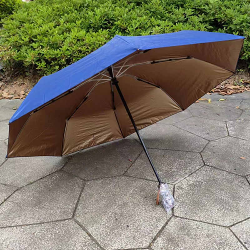 Spot al por mayor 30% de descuento automático de vinilo protector solar paraguas creativo británico cráneo dorado pegamento paraguas plegable automático