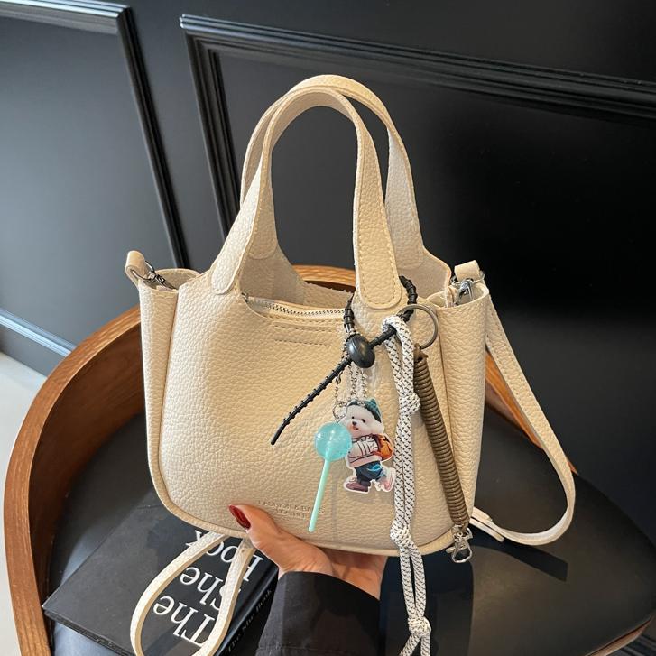 Bolso de cubo de mano transfronterizo sentido de alta gama para mujer 2025 nuevo bolso de mensajero de un solo hombro simple y versátil bolso de canasta de verduras de nicho