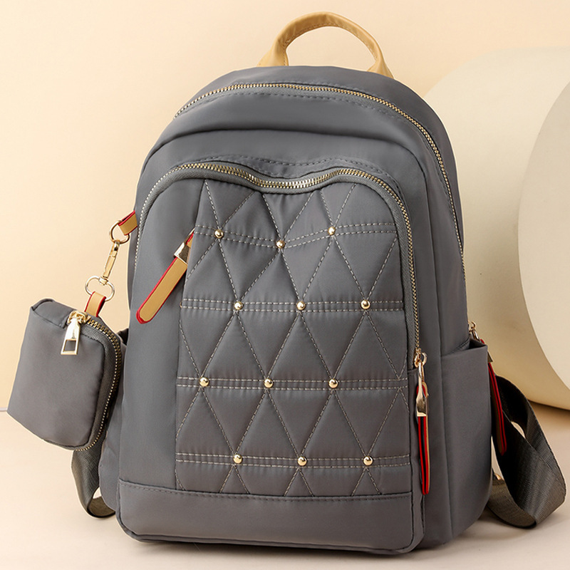 2024 nueva mochila de color de contraste para mujer de moda Lingge ocio de gran capacidad al aire libre mochila de viaje ligera al por mayor