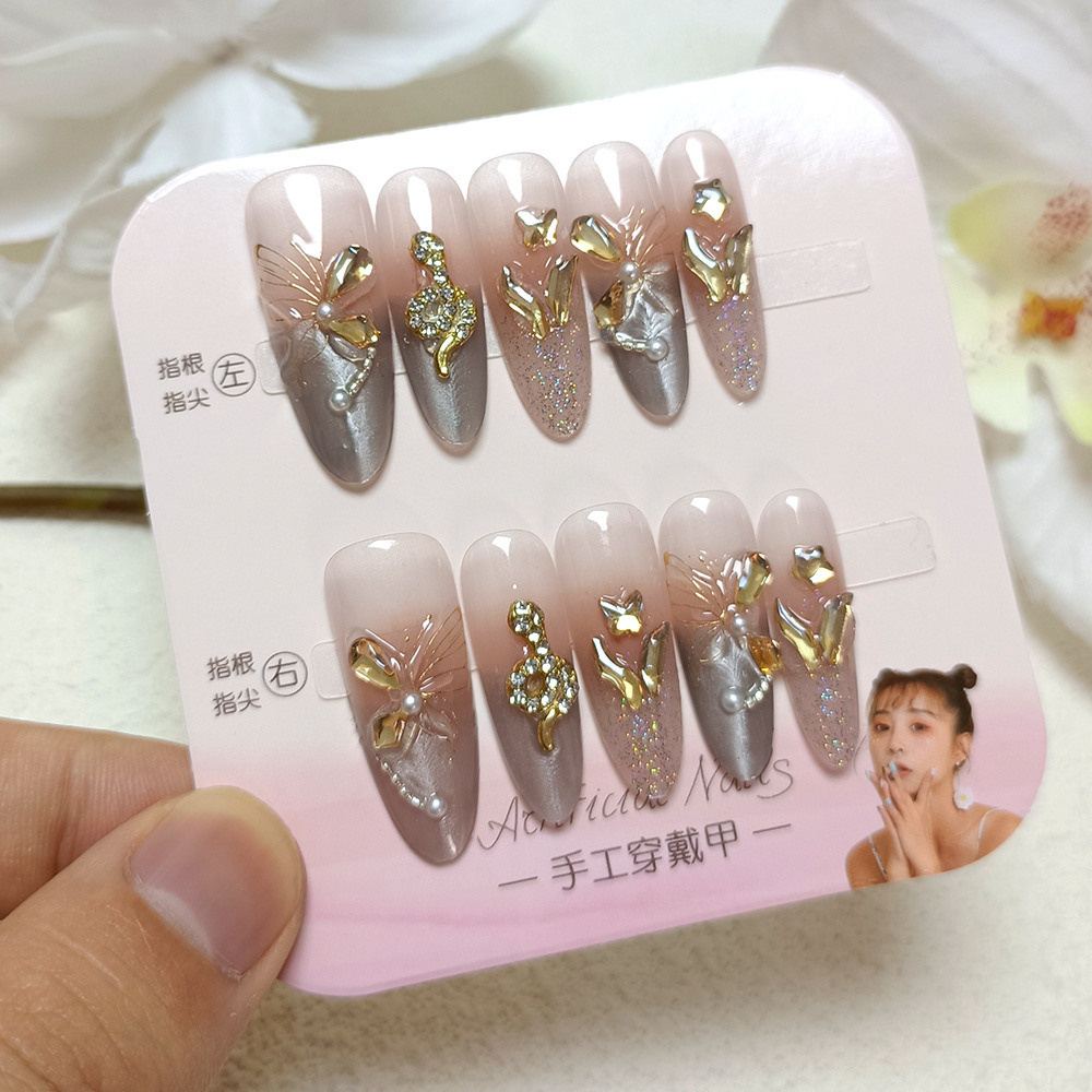 10 piezas de decoración de uñas con diseño de serpiente dorada, pegatinas de uñas con diamantes de imitación a la moda, uñas postizas de alta gama con efecto ojo de gato hechas a mano.