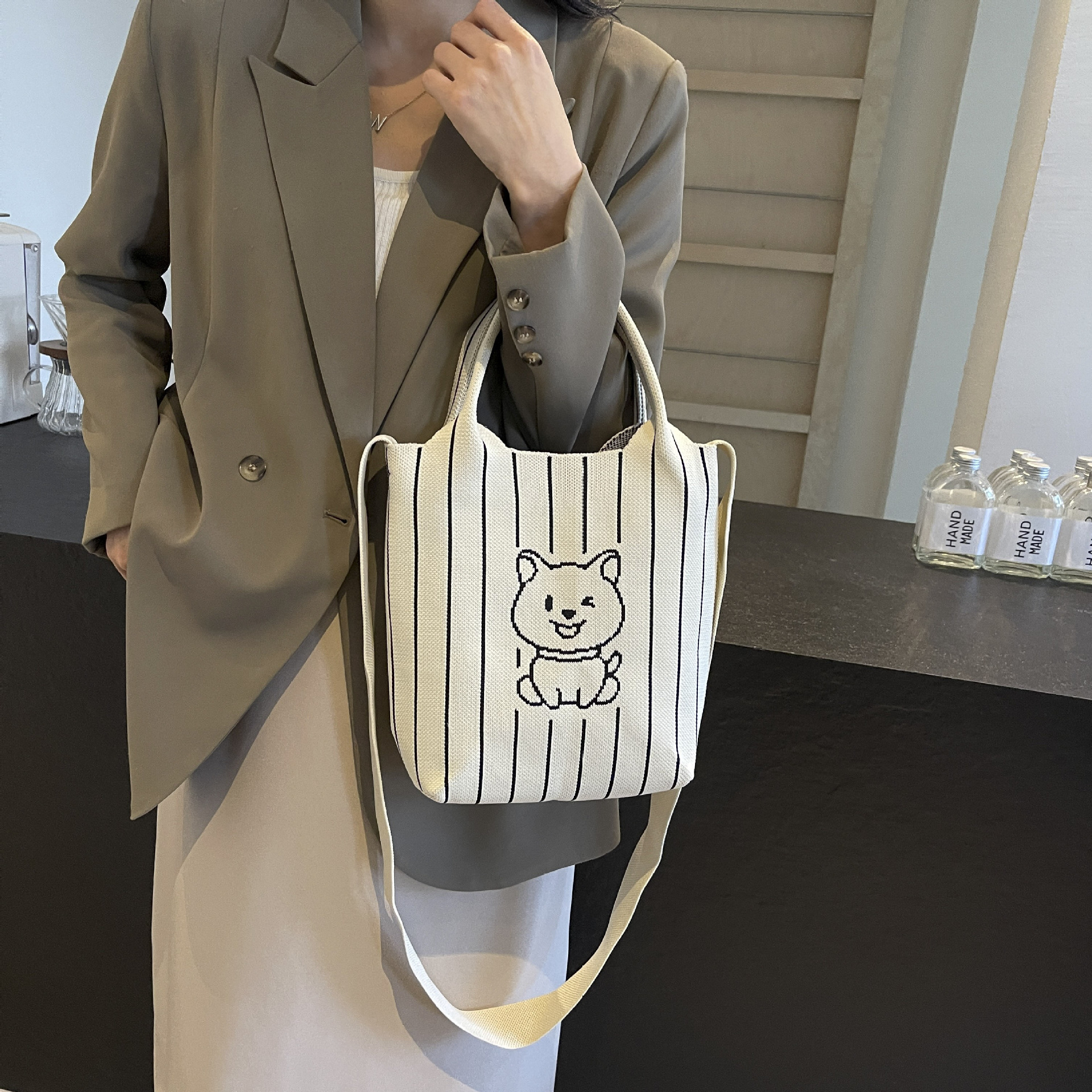 This handbag is a stylish knitted striped shopping bag. It's a popular lady's bear large-capacity tote single-shoulder bag for going out full figure