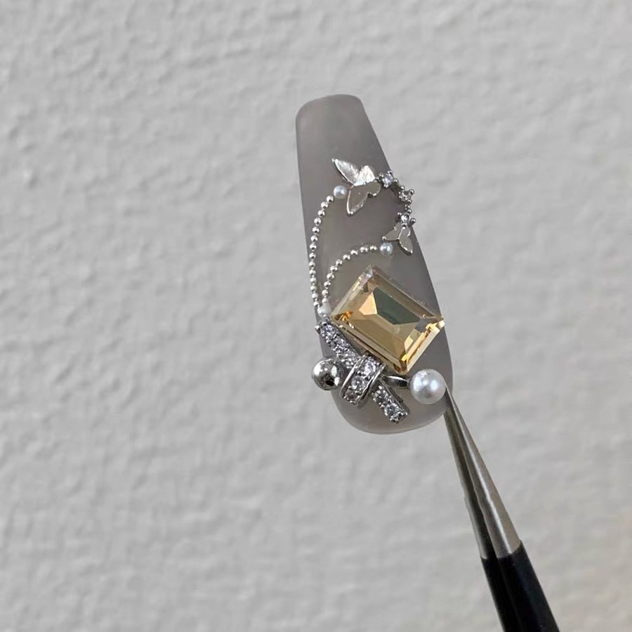 Celebridad de Internet nuevos accesorios de uñas Iris arco de alta retención de color ajuste arco de uñas diamante desgaste material de uñas diamante