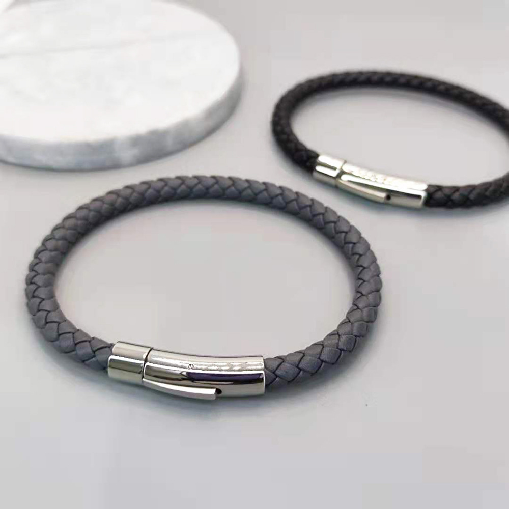 AliExpress European and American foreign trade Men's titanium steel leather woven bracelet magnet snap bracelet jewelry manufacturers wholesale