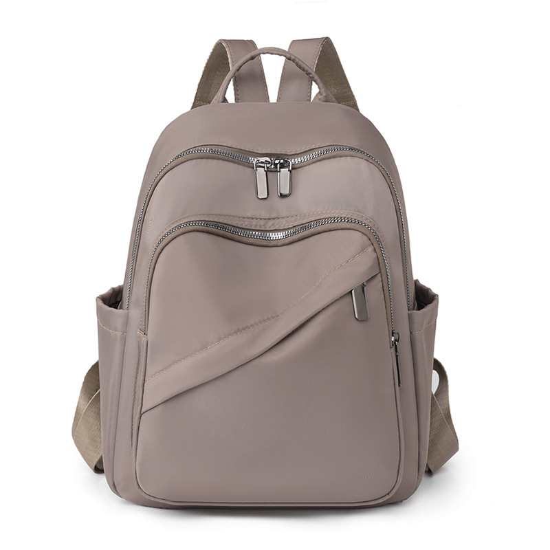 2023 verano nuevo estilo casual color sólido damas mochila de nailon moda salvaje mochila de viaje de gran capacidad al por mayor