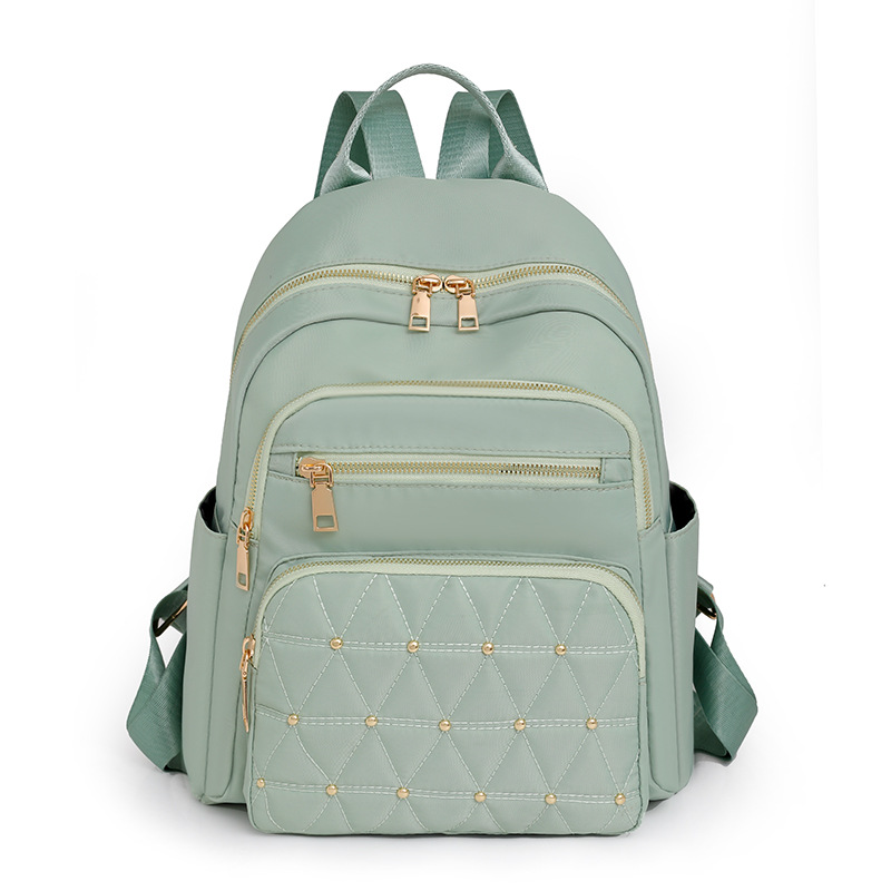 Comercio exterior al por mayor 2023 nuevas señoras casuales mochila de nailon moda remache almacenamiento al aire libre mochila de viaje marea