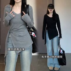 太ったmmの大きいサイズの婦人服の中で長いタイプの修身はやせている長袖のtシャツの不規則な開叉のひもの底のシャツの上着を現します。