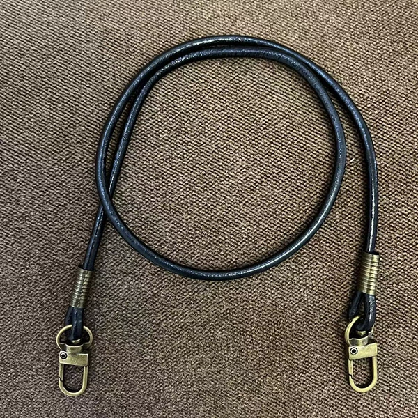 Black leather rope and bronze buckle