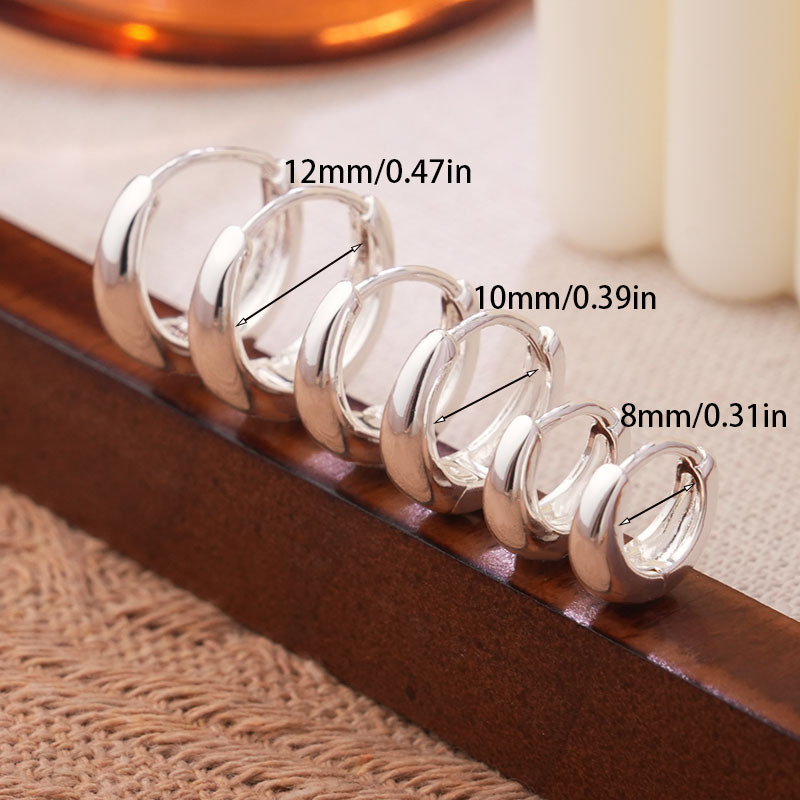 Temperamento coreano nicho 925 pendientes de plata simple personalidad femenina simple brillante joyería de viento frío al por mayor