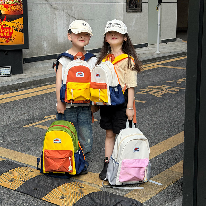 Jardín de infantes para hombres y mujeres, mochila de color extranjero, mochila de estudiantes de primaria de gran capacidad, 2026 nueva mochila infantil transfronteriza