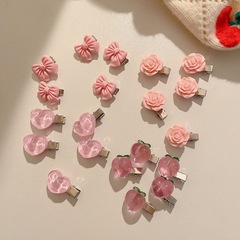 甘いピンクのヘアピンのカチューシャシリーズの柔らかい妹の少女の蝶結びの水蜜桃のツバキの花の桃の心の辺の髪飾り