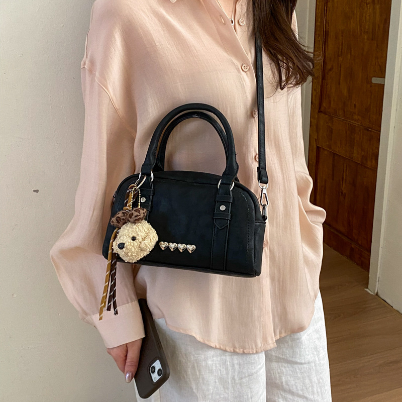 Bolso de mano coreano sensación cotidiana para mujeres 2026 primavera nuevo retro bolso de almohada de hombro para viajar bolso de mujer