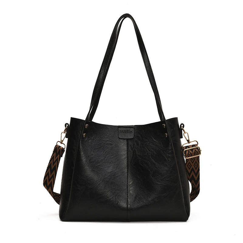 Europa y los Estados Unidos retro gran capacidad de transporte tote2025 nuevo bolso textura ancha cintura de hombro mochila bolso de hombro