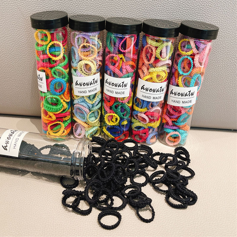 La banda de goma del bebé de los accesorios del pelo de los niños no lastima el pelo del bebé elástico tamaño pequeño de la banda del pelo de la muchacha de la cuerda del lazo del pelo de la muchacha