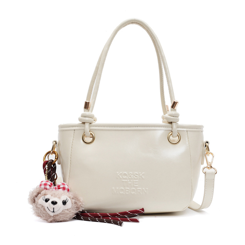 Bolsa de cubo retro explosiva para mujeres 2025 nuevo bolso de nicho de diseño de alta humedad versátil bolso de hombro