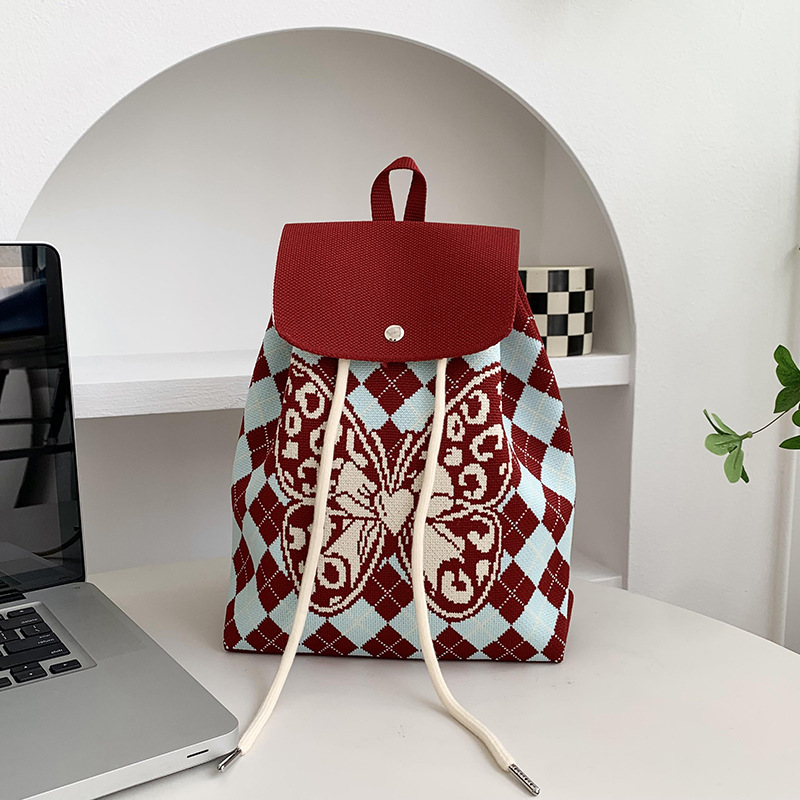 Mochila de alta calidad para damas nueva personalidad de dibujos animados versátil de gran capacidad de viaje bolsa de tejido portátil mochila de punto