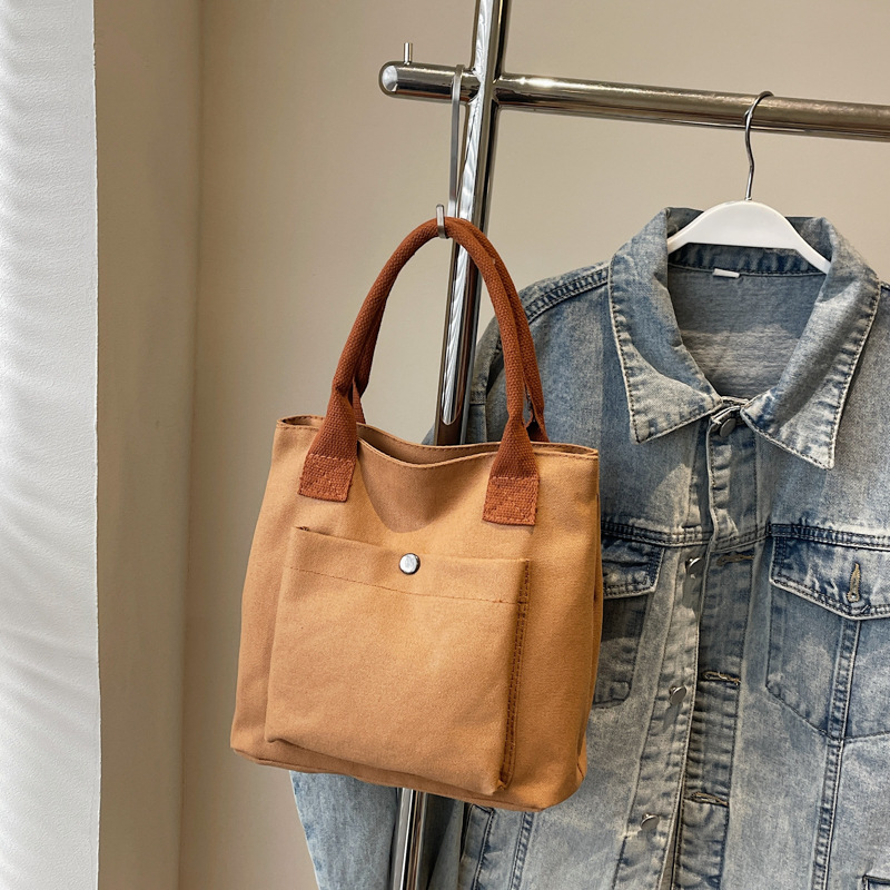 2024 nuevo bolso de lona para mujeres tela japonesa retro simple versátil Harajuku bolso de mano de color sólido casual de moda para mujeres