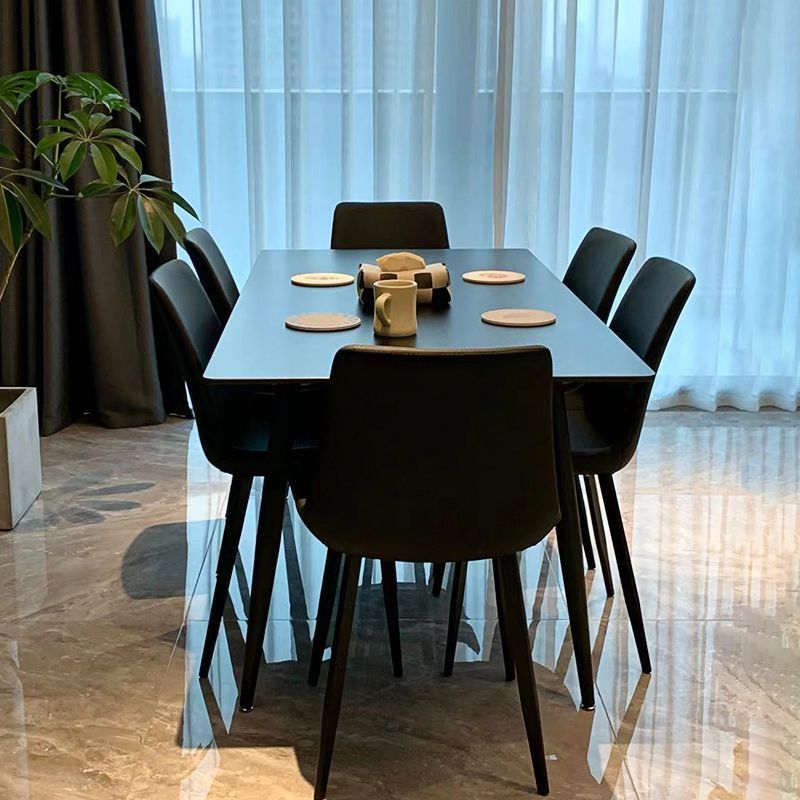 Mesa de comedor de tabla de roca minimalista italiana pequeña casa moderna rectangular combinación de mesa de comedor negra silla de mesa de ocho semillas mesa única