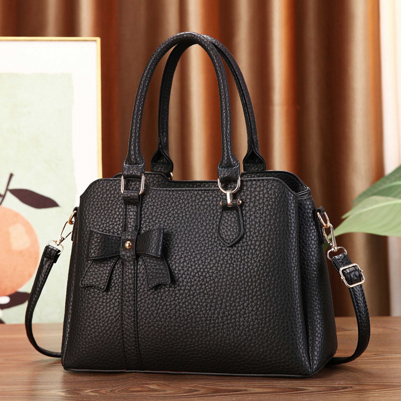 Botón arco lichi estampado bolso de mano temperamento bolso de hombro de moda casual versátil mochila bolsas transfronterizas