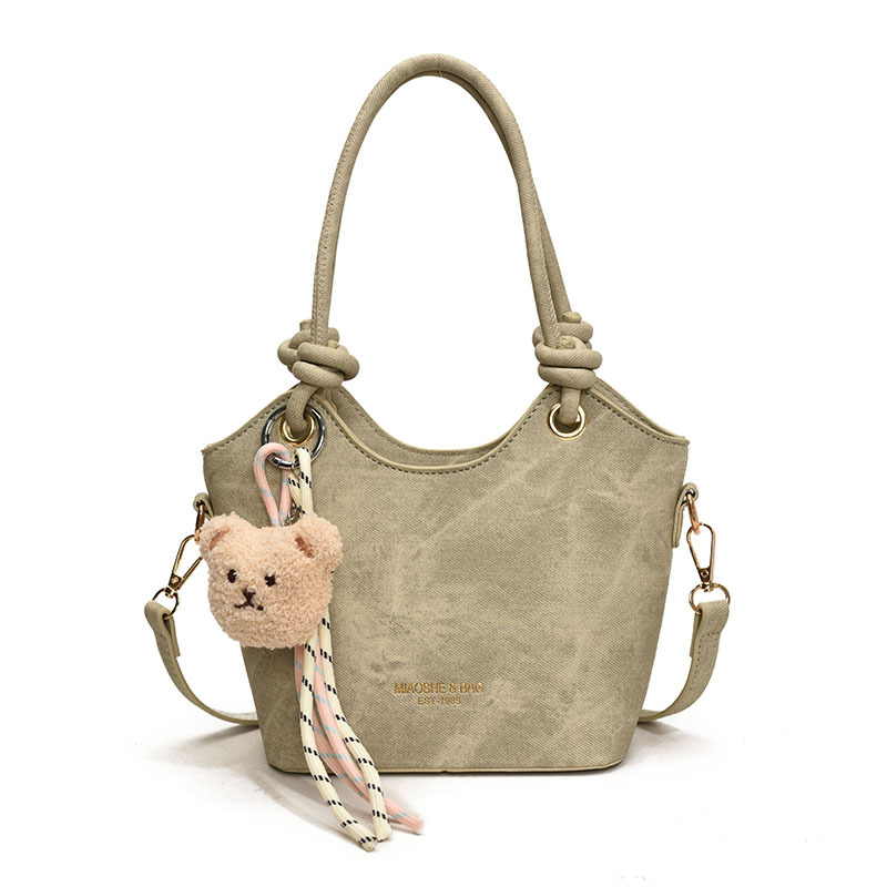 Corea del Sur ins moda bolso de cubo de mano 2025 nuevo estilo simple ocio versátil bolso de hombro textura superior