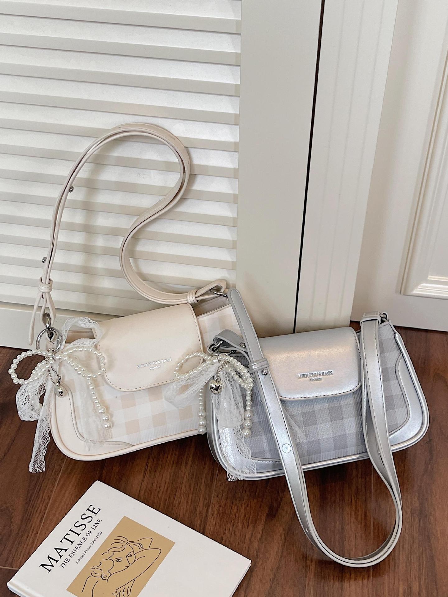 Bolso de axila de diseño de nicho a cuadros de estilo occidental 2025 nuevo bolso de hombro de todo fósforo de color en contraste bolso de mensajero de moda de alta gama
