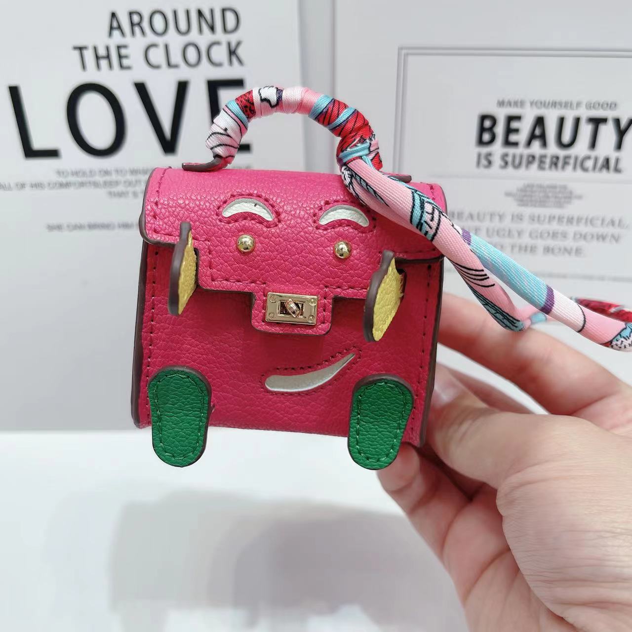 Lindo mini bolso de muñeca Kelly personalidad de nicho auricular Bluetooth inalámbrico bolso universal colgante pequeño premium marca de moda mujer