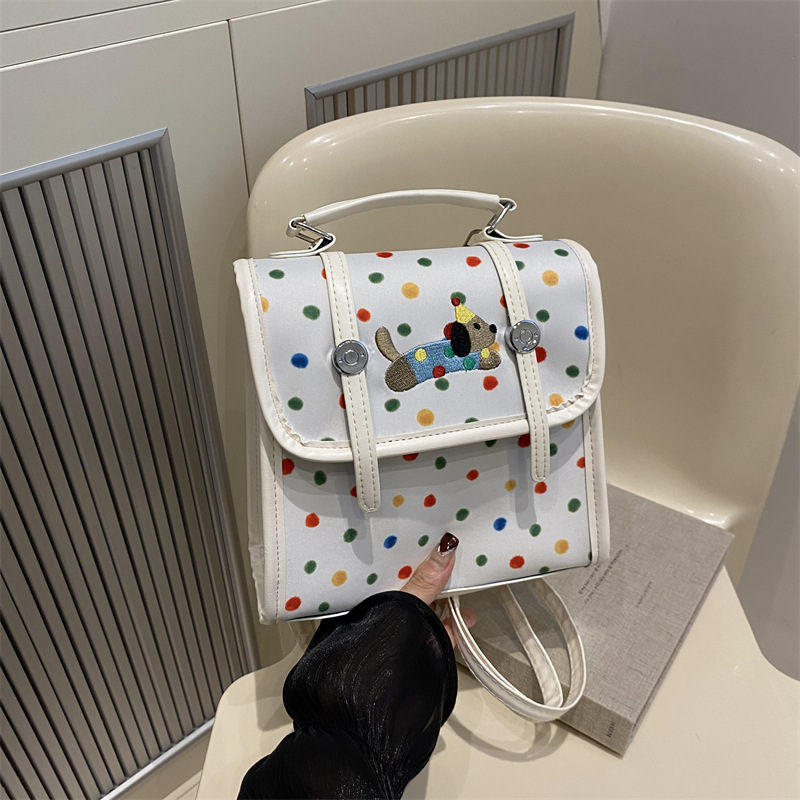 Cute bolso de mujer de dibujos animados 2024 nuevo estilo versátil texturas de estilo de viaje simple mochila de estilo universitario