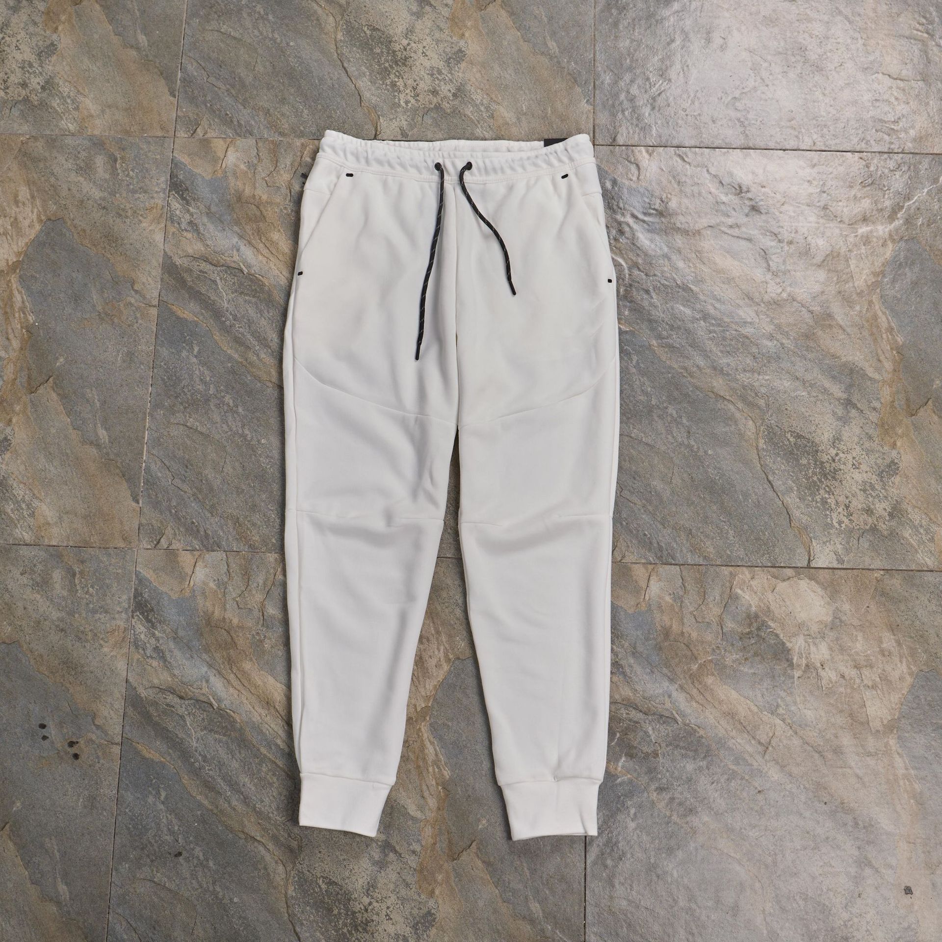 Pantalones casuales deportivos primavera y otoño aire laminado de algodón con cremallera pantalones deportivos para hombres y mujeres