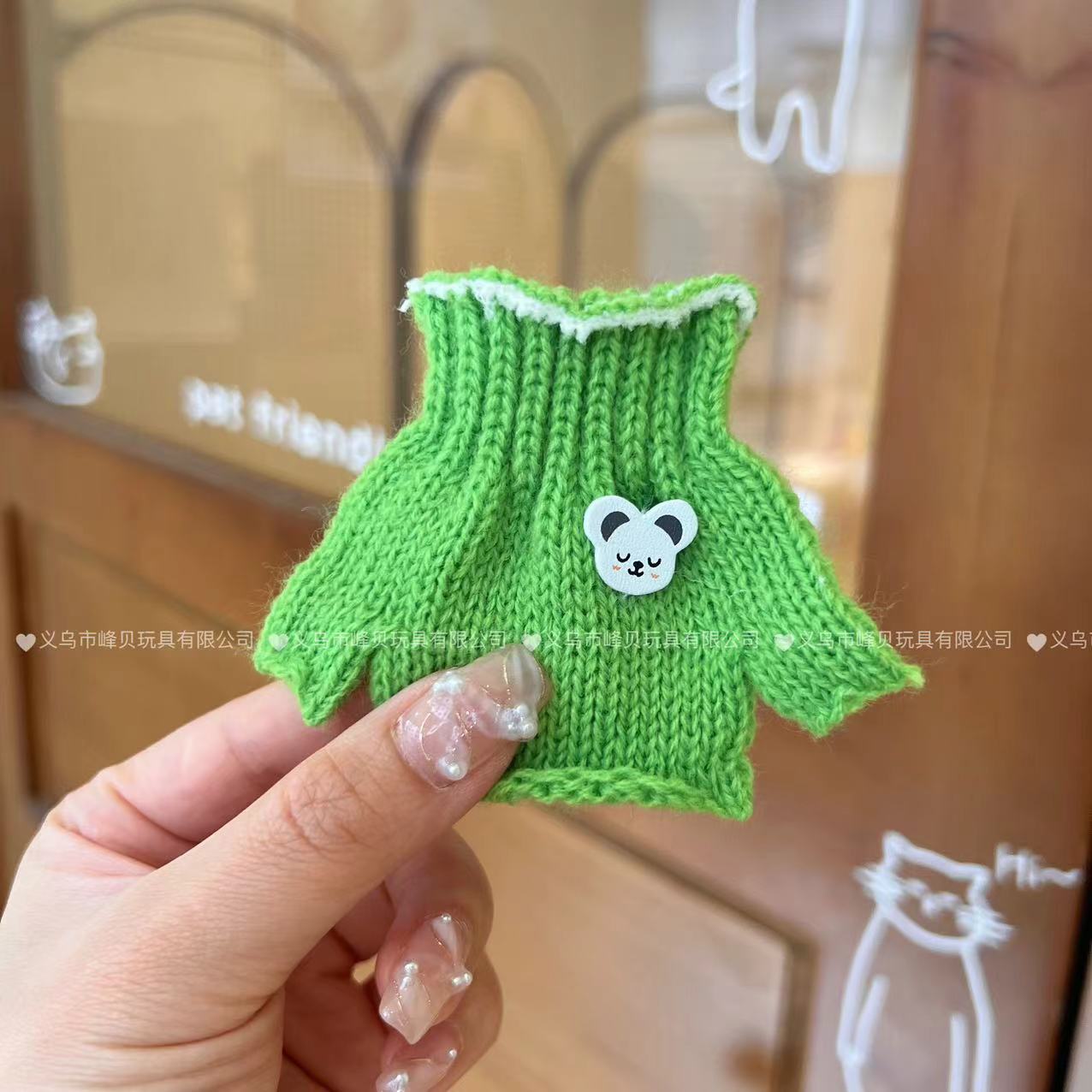 Green knitted turtleneck sweater