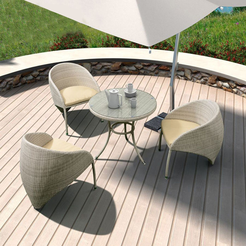 Three-piece outdoor sofa set, featuring wicker weaving, perfect for leisure and relaxation, including a patio umbrella, table, and chairs