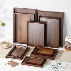 くるみの濃い色のコップの収納取っ手の家庭用の大きいサイズの日本式の茶器の皿の竹の木のケーキの展示のトレー