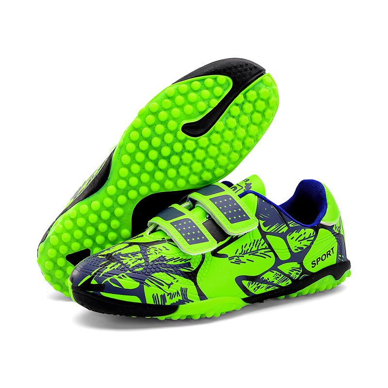 Niños y niñas transfronterizos transpirables cómodos deportes ociosos bajos clavos de clavos de hierba competición zapatos de fútbol de fábrica para niños
