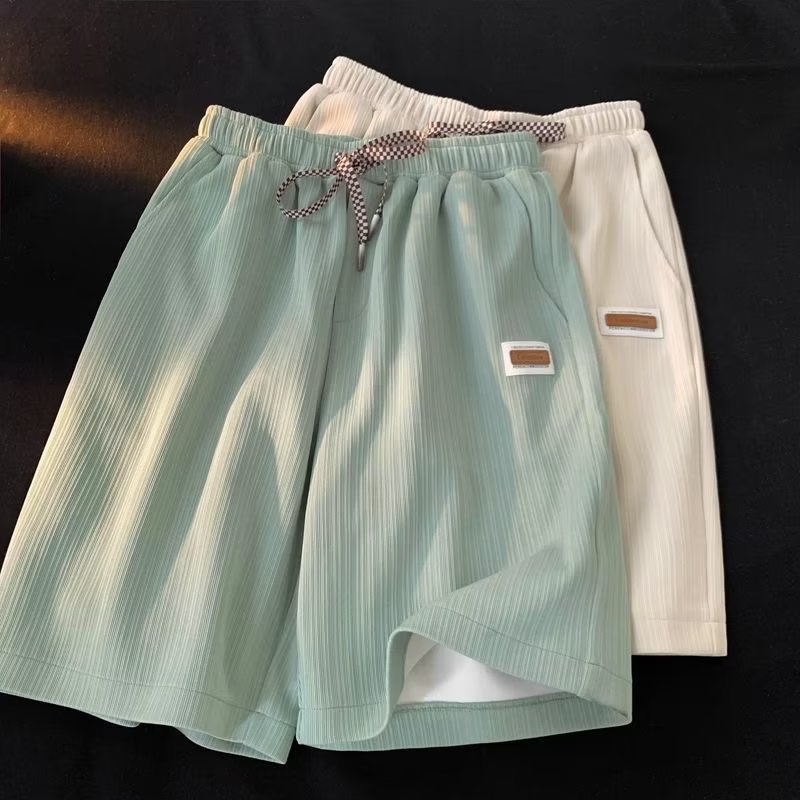Pantalones cortos de seda de hielo de verano serie de sal suelta para hombres 2023 nuevos pantalones casuales de pierna ancha ins pantalones cortos rectos de moda