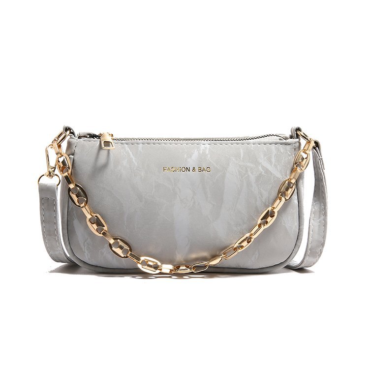 Popular 2024 nuevo viaje de invierno mochila de hombro de textura de moda mochila de nicho de diseño de cadena bolso debajo de la axila