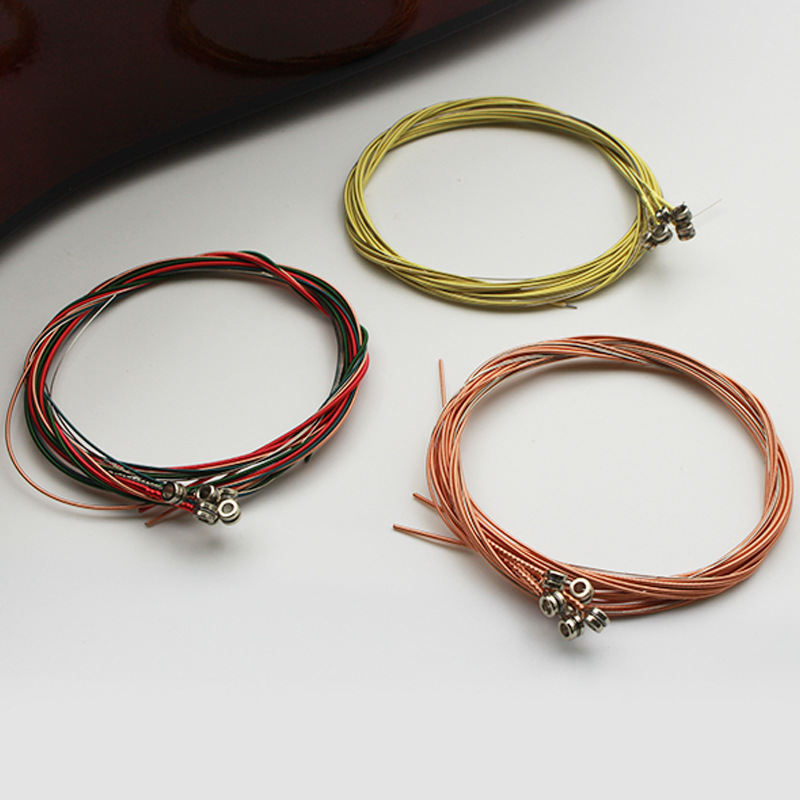 Cuerda de guitarra folk cuerda de latón cadena de color cobre rojo embalaje independiente cuerda de corte cuerda de cuerda herramienta de cambio de instrumento musical Accesorios