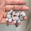 2508118A white grape bunch ear hook earrings