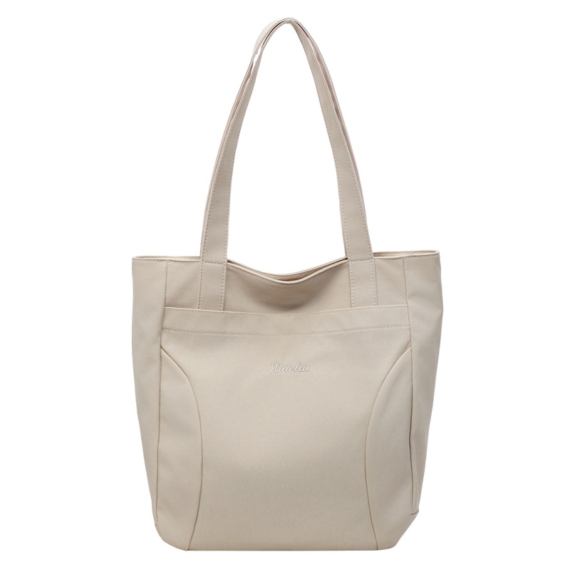 Bolsa de lona para mujeres nuevo estilo japonés retro simple de color sólido gran capacidad bolsa de transporte universal mochila universitaria