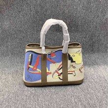 真皮手提彩绘包高级感女包2025新款热卖涂鸦帆布配头层牛皮花园包