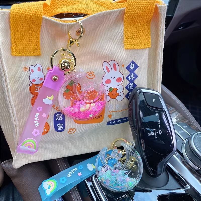 Red de aceite creativo rojo luminoso copo de nieve estrella Luna conejo Quicksand botella llavero femenino lindo Quicksand botella colgante bolsa adornos