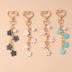 甘いins真珠桜のキーホルダーシンプルな花の花の携帯電話のペンダントのハンドバッグのリュックサックの装飾品